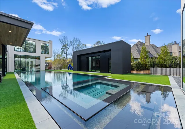 a view of swimming pool with a patio