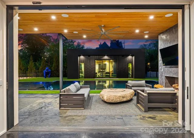 a outdoor space with patio furniture and a fireplace