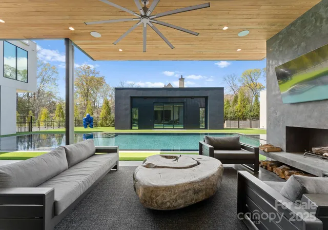 a balcony with furniture and a fireplace