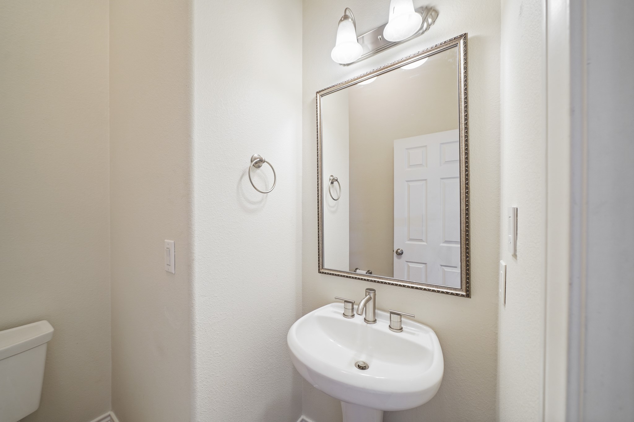 1402 Wheeler Avenue Houston, TX 77004 - Photo 11 of 40 a bathroom with a sink a toilet and mirror