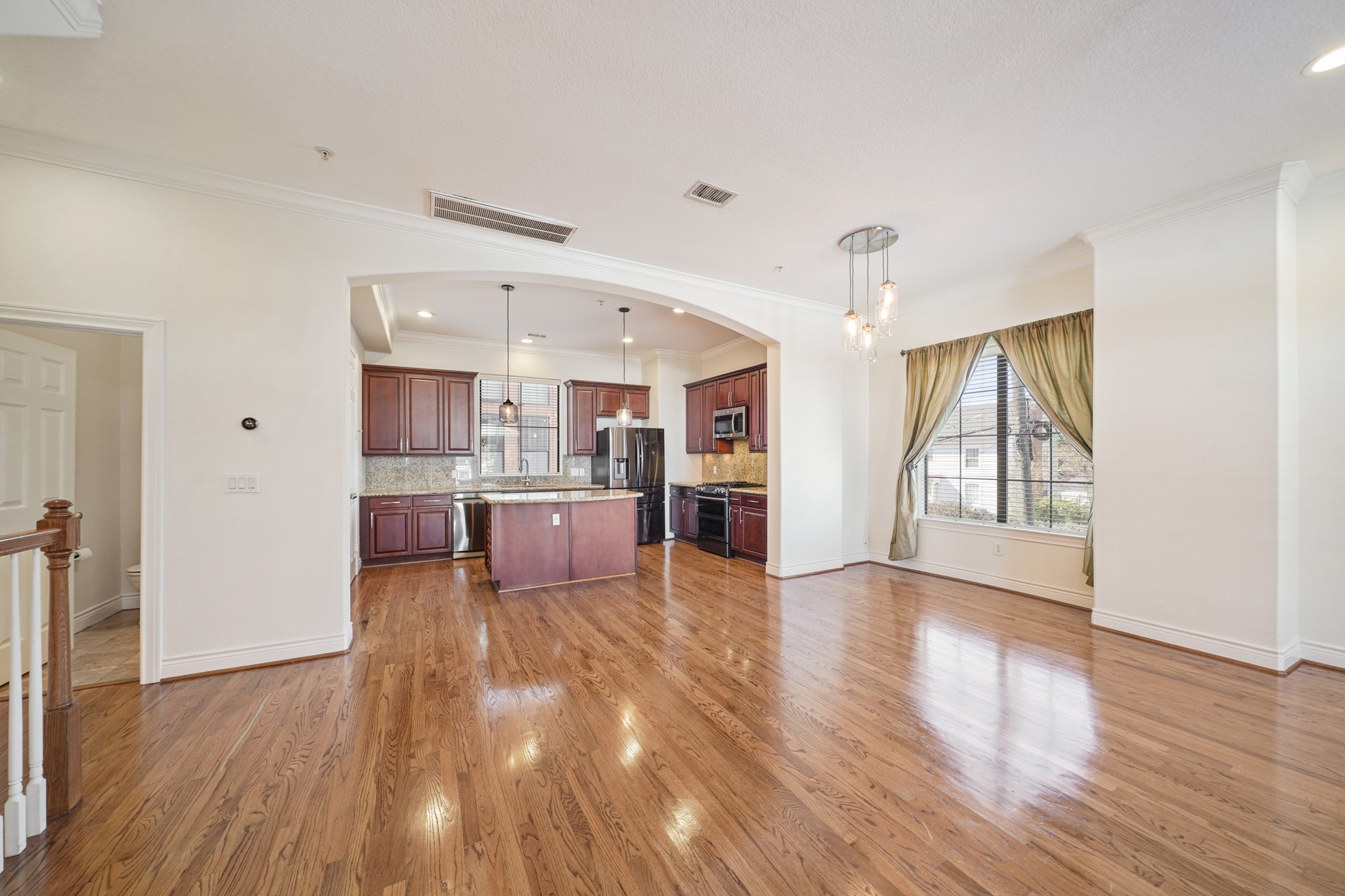 1402 Wheeler Avenue Houston, TX 77004 - Photo 12 of 40 a view of kitchen with cabinets and wooden floor