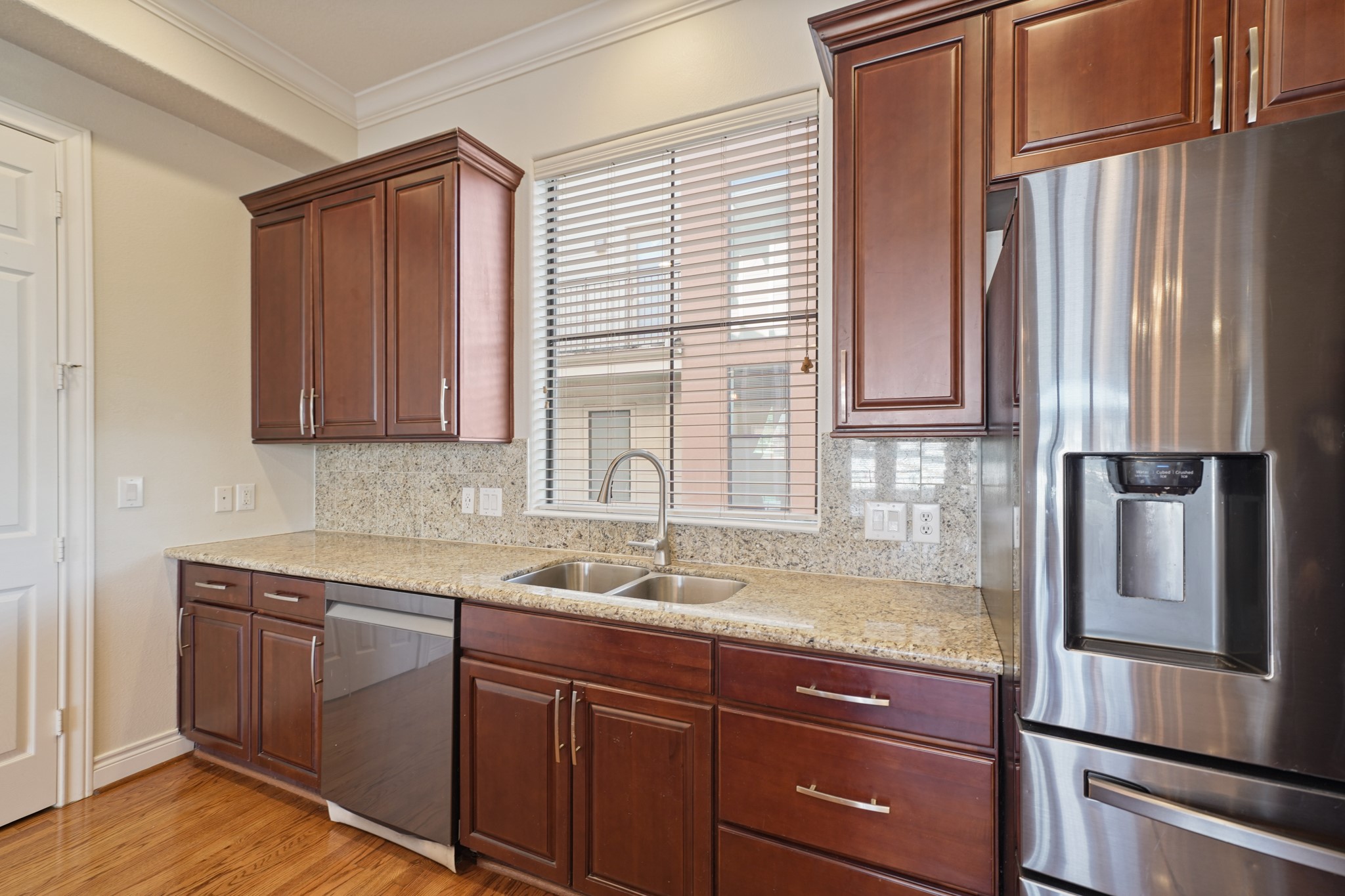 1402 Wheeler Avenue Houston, TX 77004 - Photo 16 of 40 a kitchen with a sink and a refrigerator