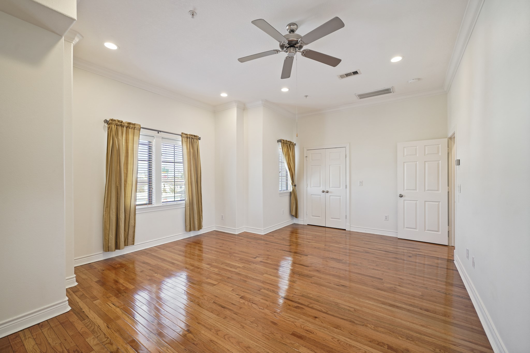 1402 Wheeler Avenue Houston, TX 77004 - Photo 20 of 40 a view of an empty room with a window and wooden floor