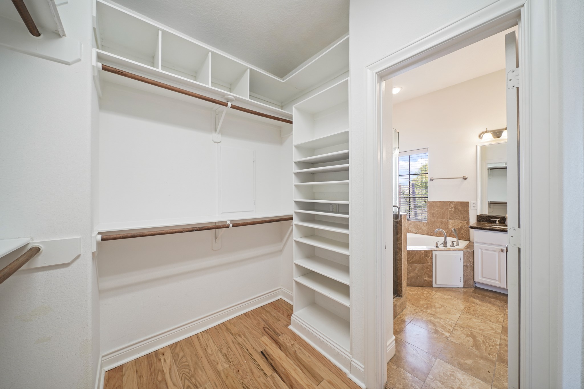 1402 Wheeler Avenue Houston, TX 77004 - Photo 26 of 40 a view of walk in closet with empty racks