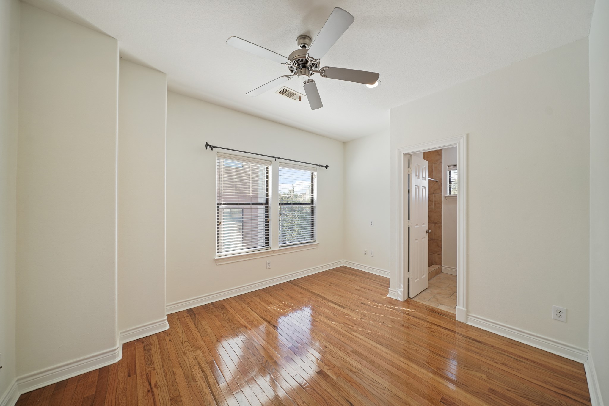 1402 Wheeler Avenue Houston, TX 77004 - Photo 28 of 40 wooden floor in an empty room with a window