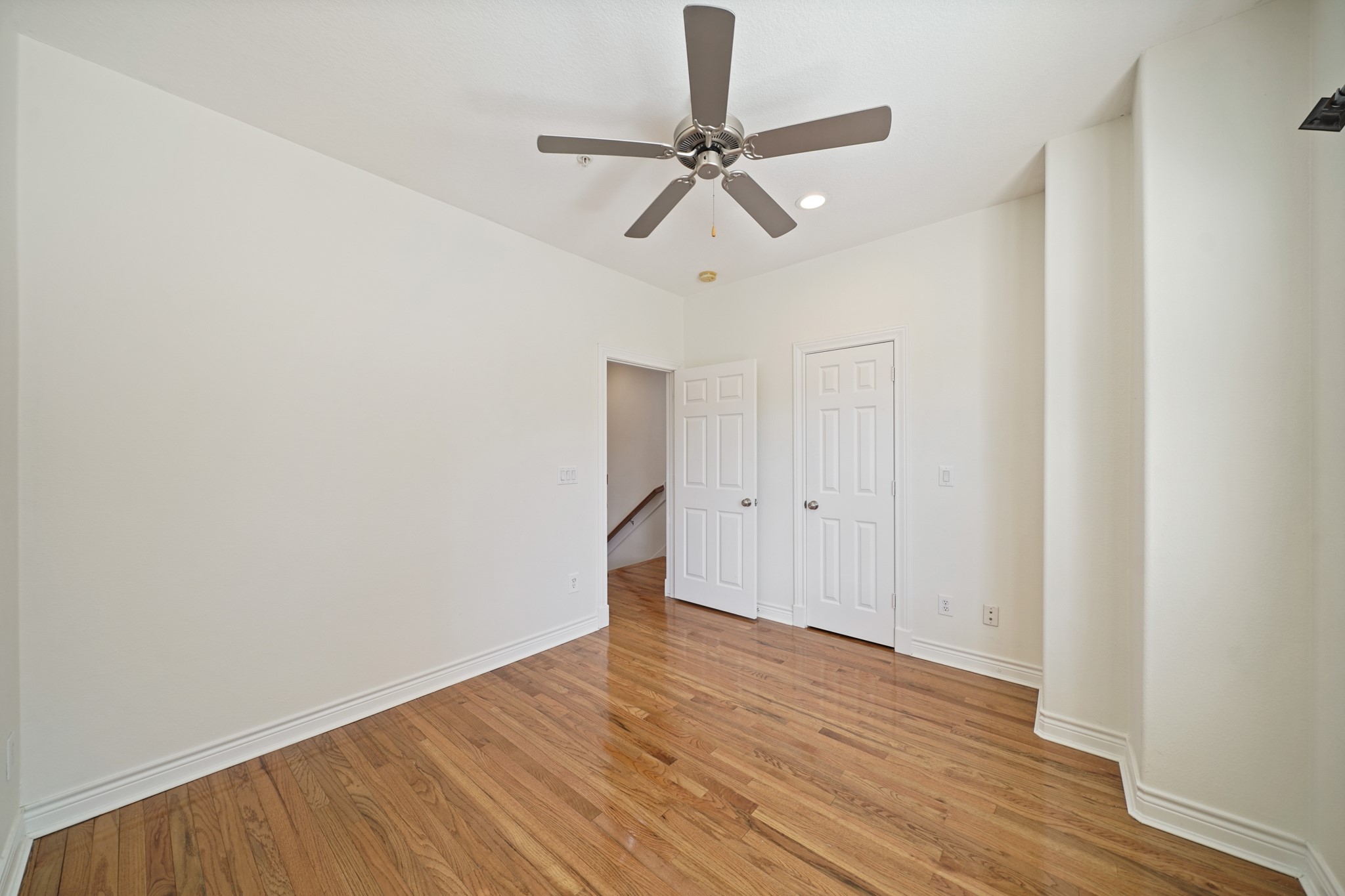 1402 Wheeler Avenue Houston, TX 77004 - Photo 31 of 40 a view of a room with wooden floor and a ceiling fan