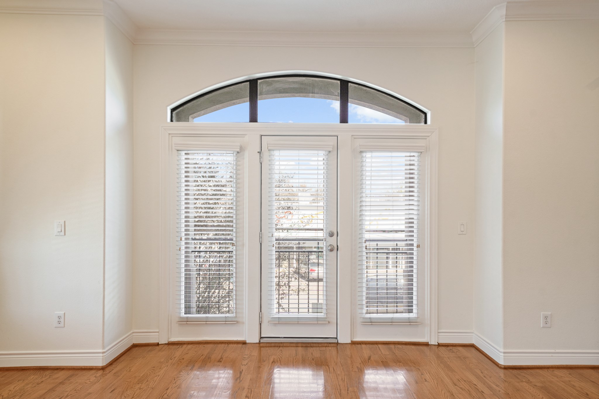 1402 Wheeler Avenue Houston, TX 77004 - Photo 8 of 40 a view of an empty room with a window and wooden floor