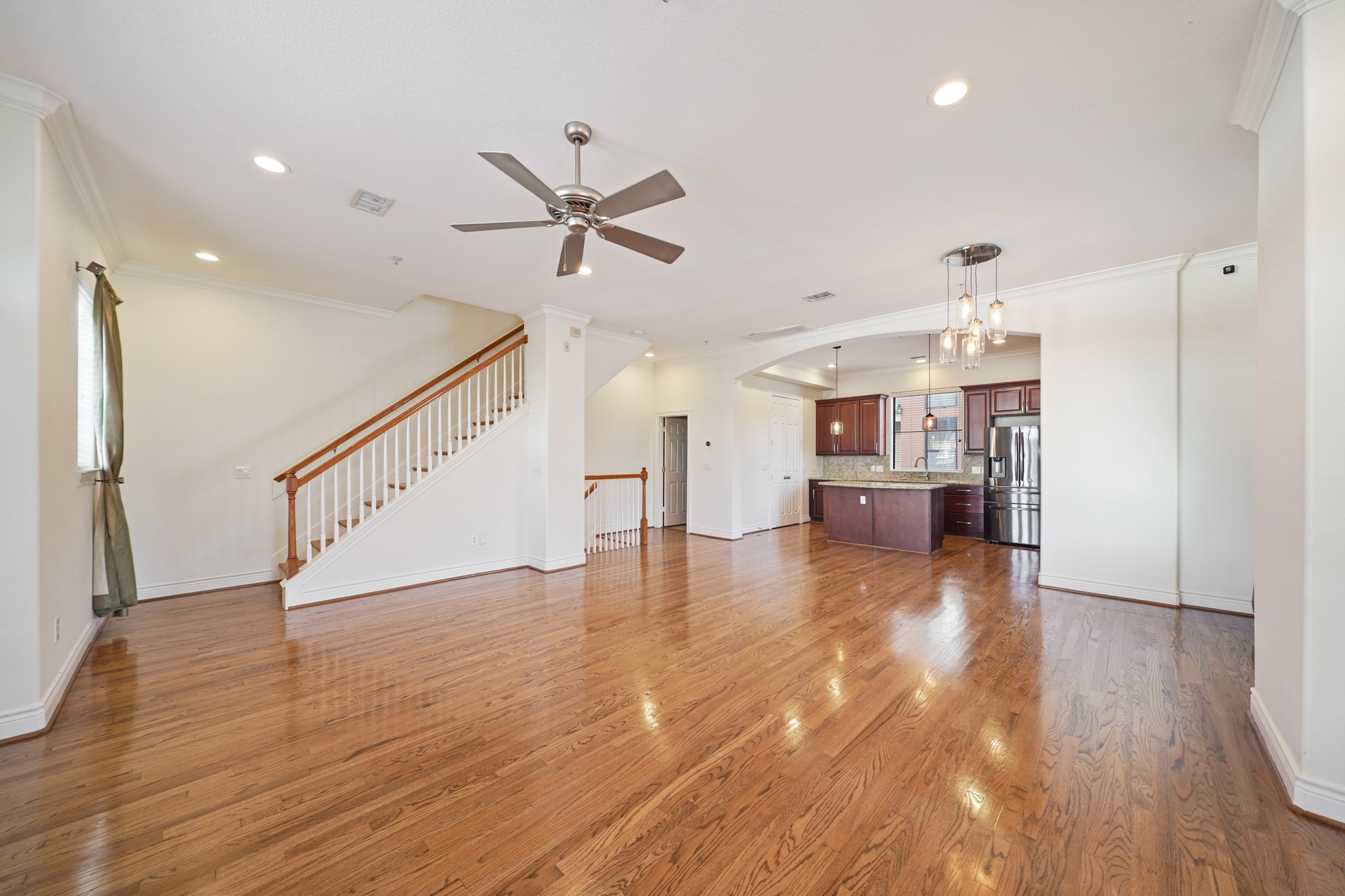 1402 Wheeler Avenue Houston, TX 77004 - Photo 40 of 40 a view of a livingroom with wooden floor and staircase