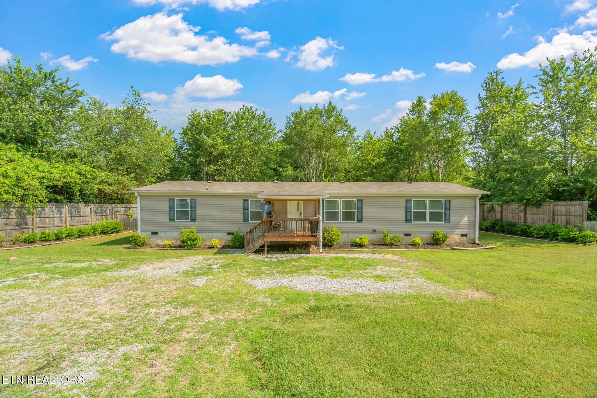 20156 Steekee Road Loudon, TN 37774 - Photo 1 of 46 a view of a house with a big yard and large trees