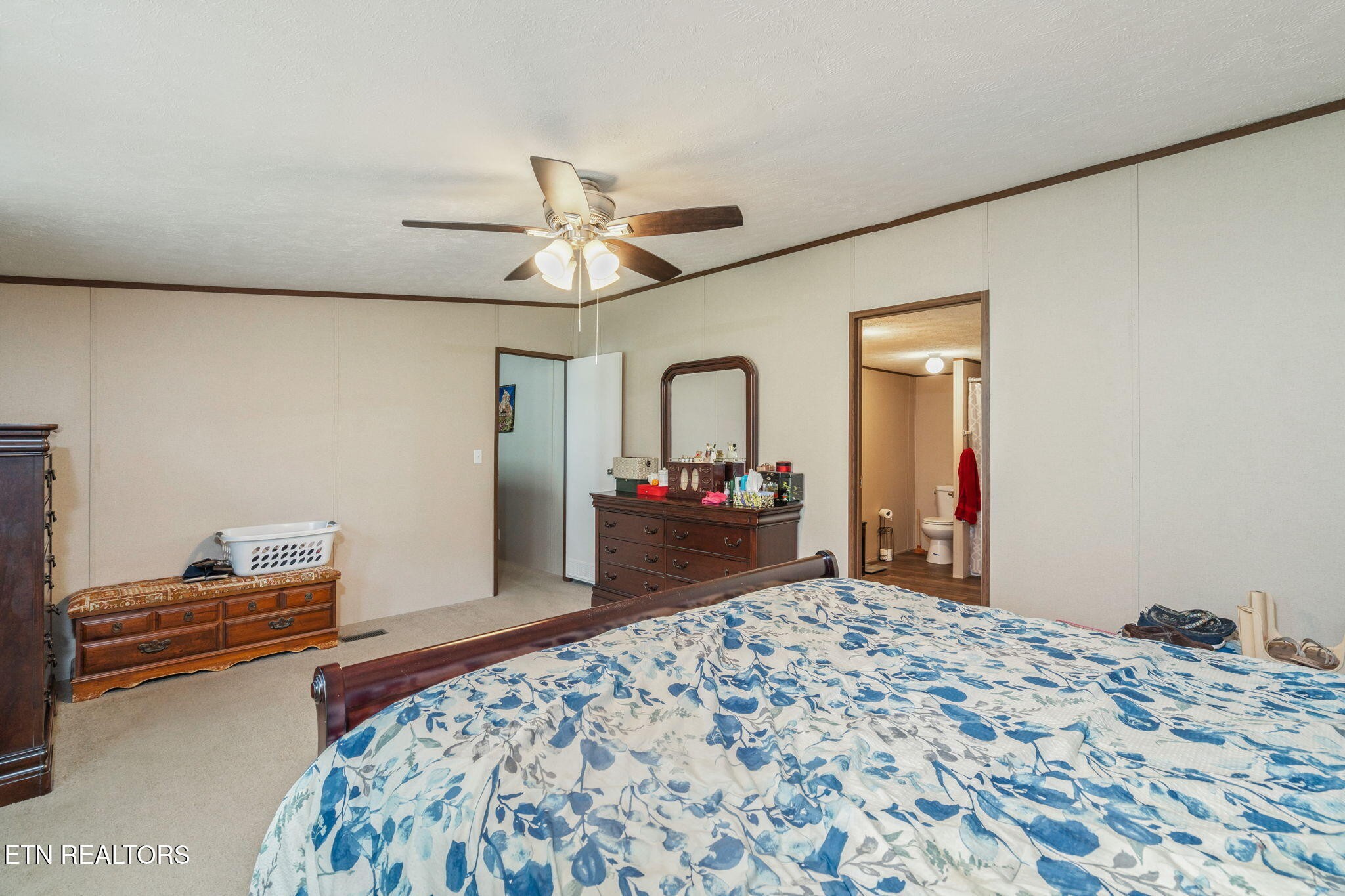 20156 Steekee Road Loudon, TN 37774 - Photo 20 of 46 a bedroom with a bed and a dresser in it