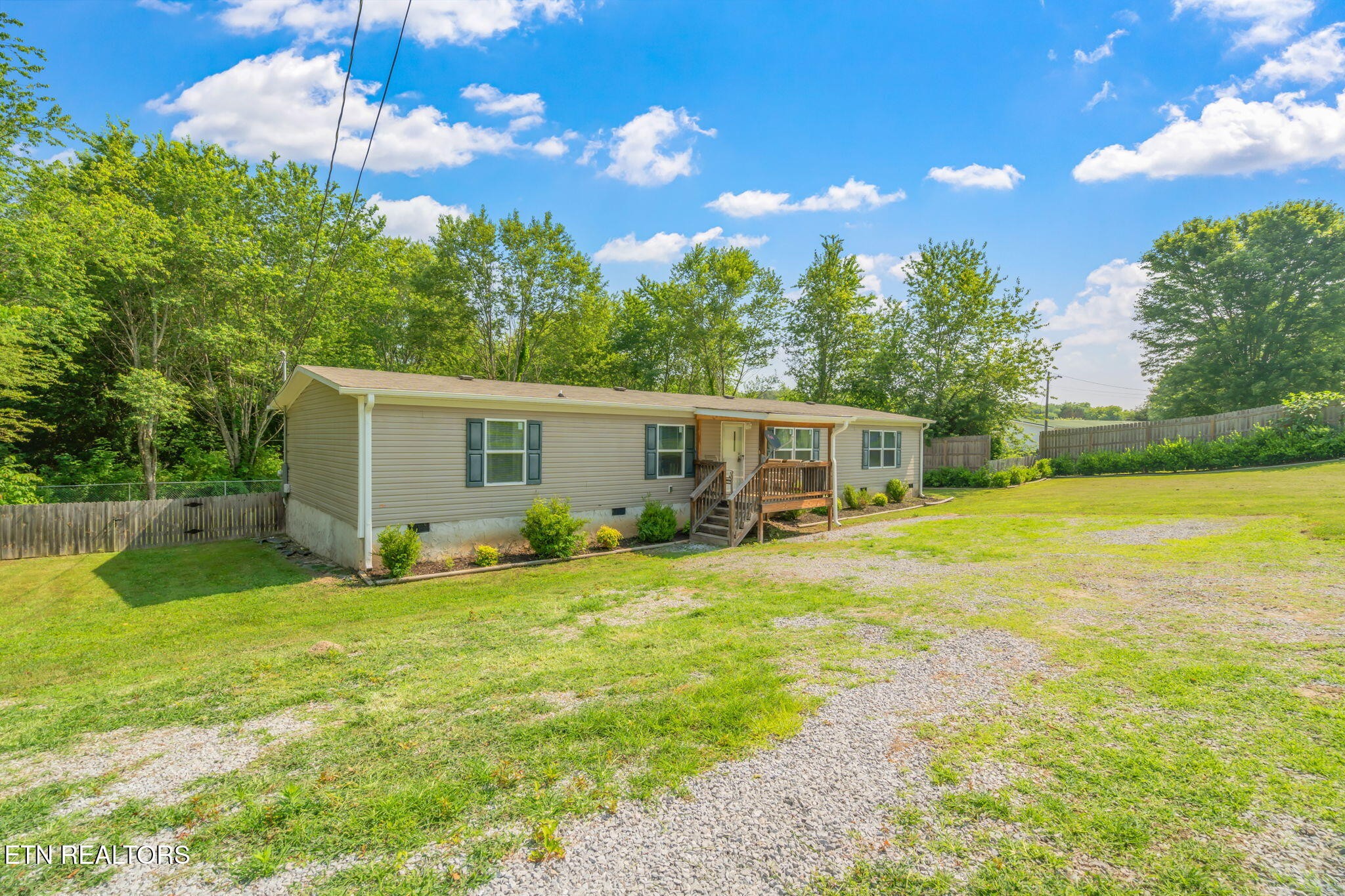 20156 Steekee Road Loudon, TN 37774 - Photo 3 of 46 a view of a house with a backyard and a patio