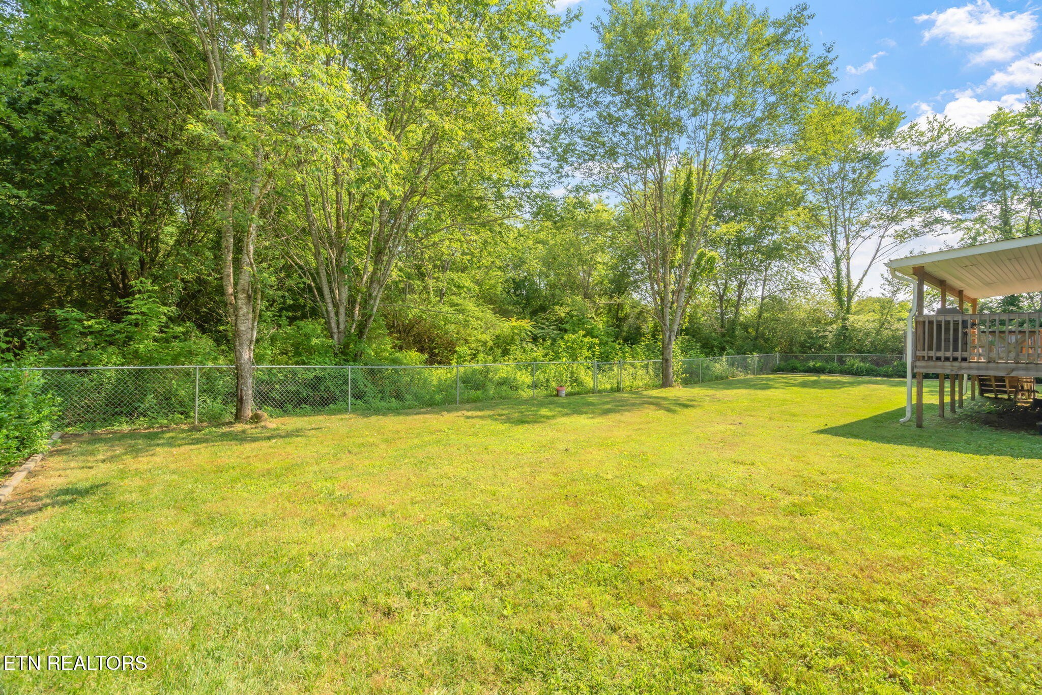 20156 Steekee Road Loudon, TN 37774 - Photo 32 of 46 a view of a swimming pool with an outdoor space and seating area