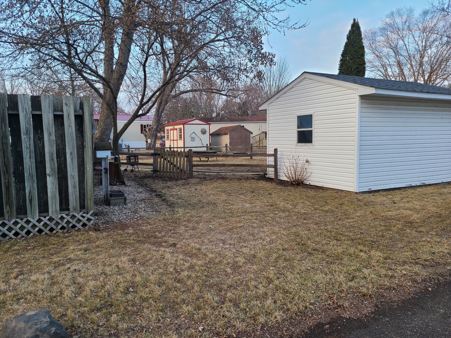 291 Highway 2, Unit 49 Dixon, IL 61021 - Photo 3 of 28 a view of a house with a yard