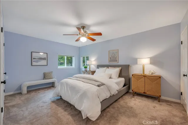 a bathroom with a double vanity sink mirror and shower