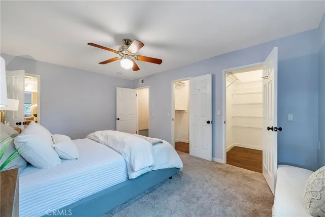 a view of a dining room with furniture and a potted plant