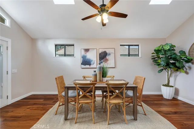 a view of staircase with wooden floor and white walls