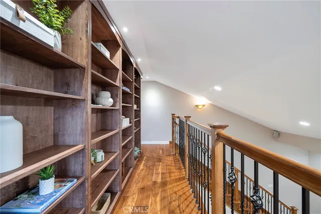 a bedroom with a bed and a potted plant