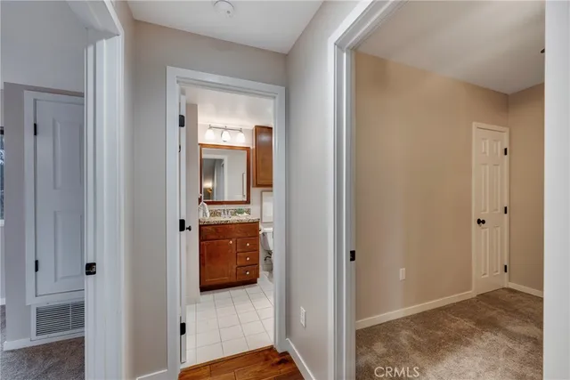 a view of a livingroom with a ceiling fan and window
