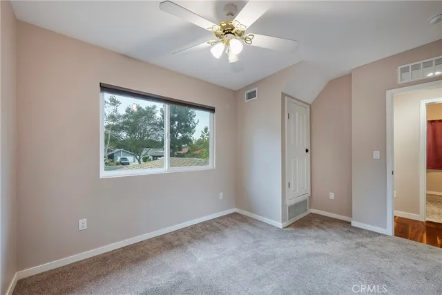 a view of a house with backyard sitting area and garden