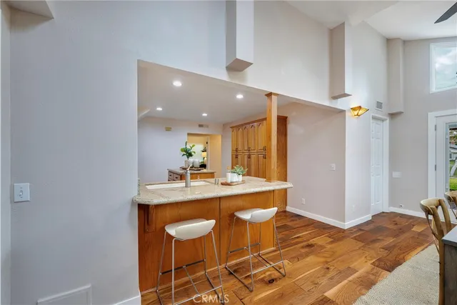a living room with furniture potted plant and a chandelier