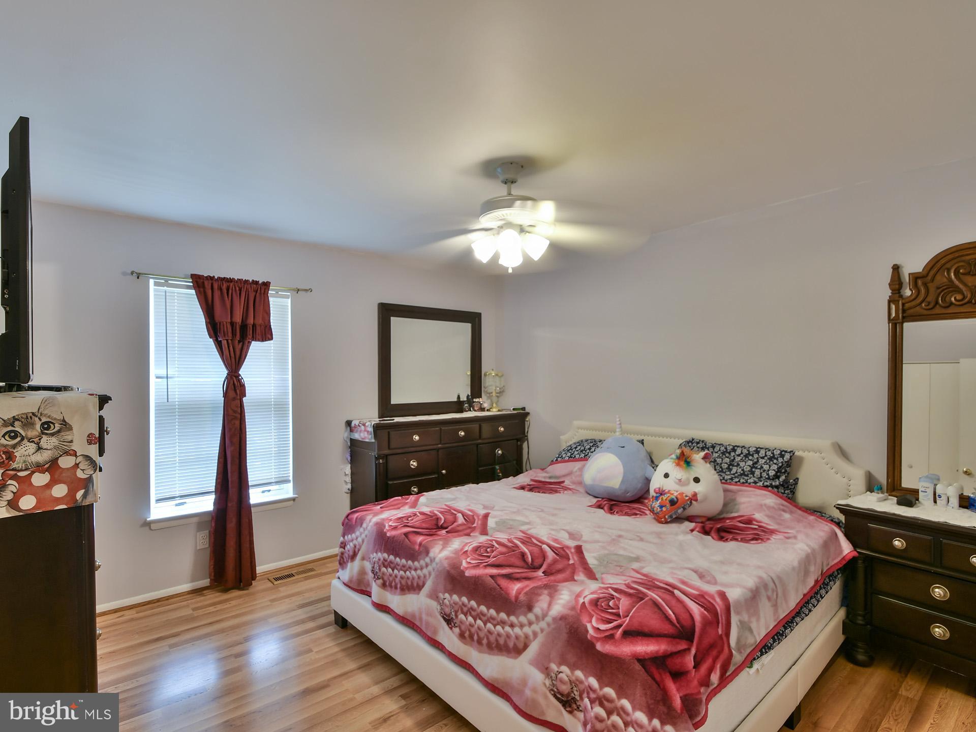 8600 Sumter Lane Clinton, MD 20735 - Photo 18 of 51 a bedroom with a bed and wooden floor