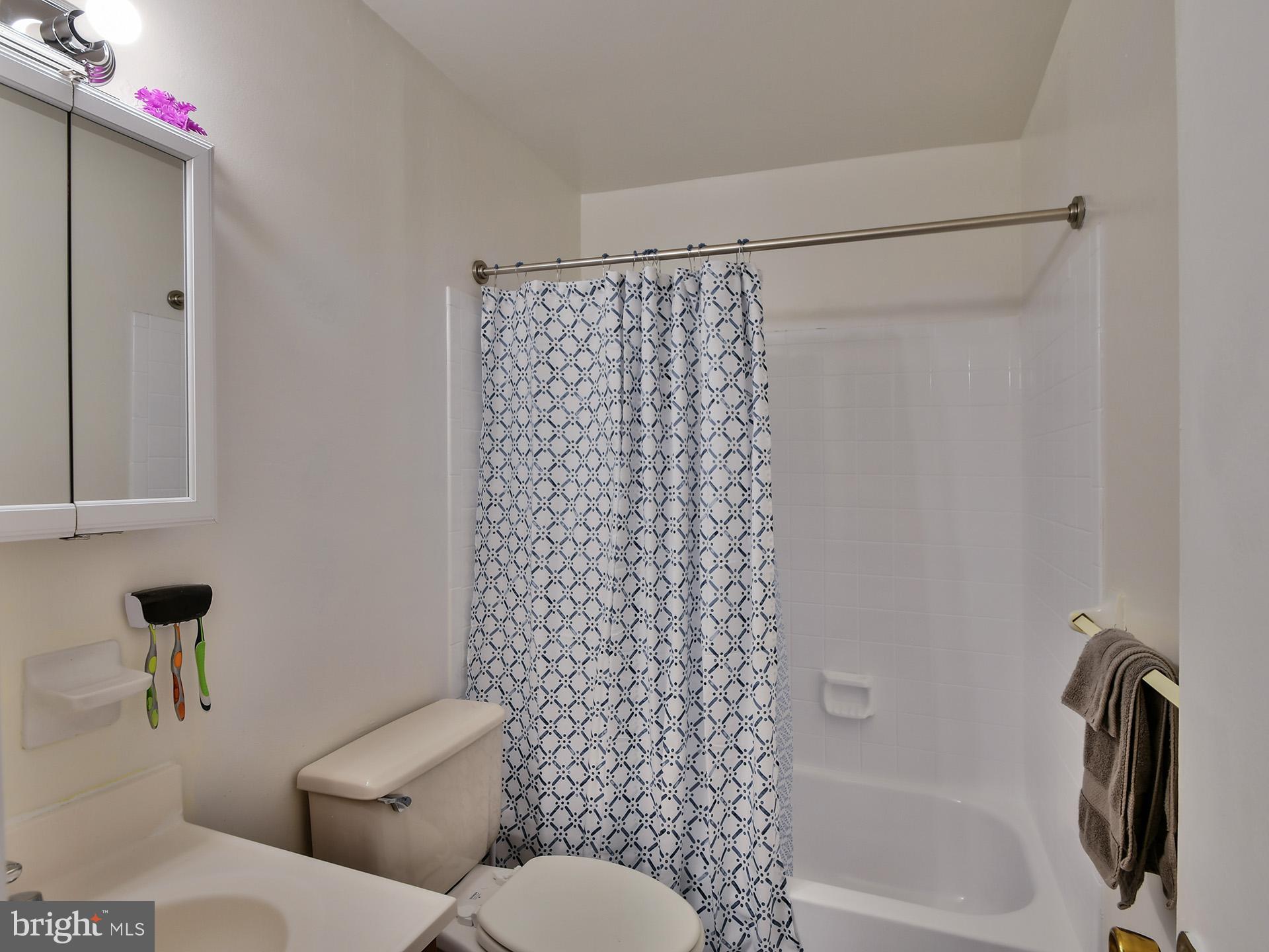 8600 Sumter Lane Clinton, MD 20735 - Photo 20 of 51 a bathroom with a toilet and a shower