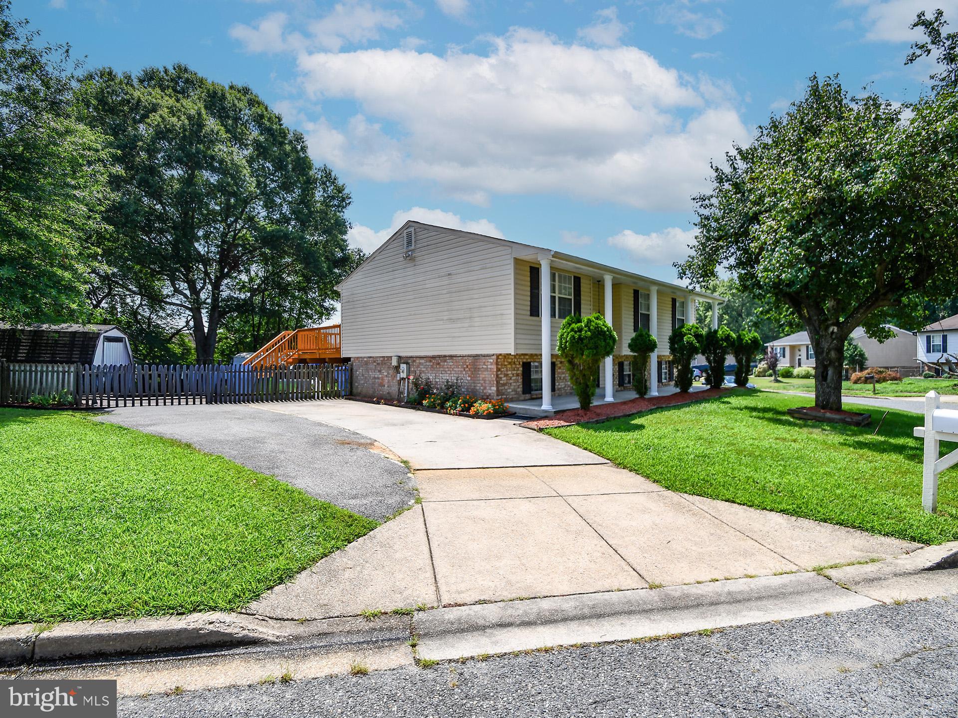 8600 Sumter Lane Clinton, MD 20735 - Photo 2 of 51 a view of a house with a yard and a street
