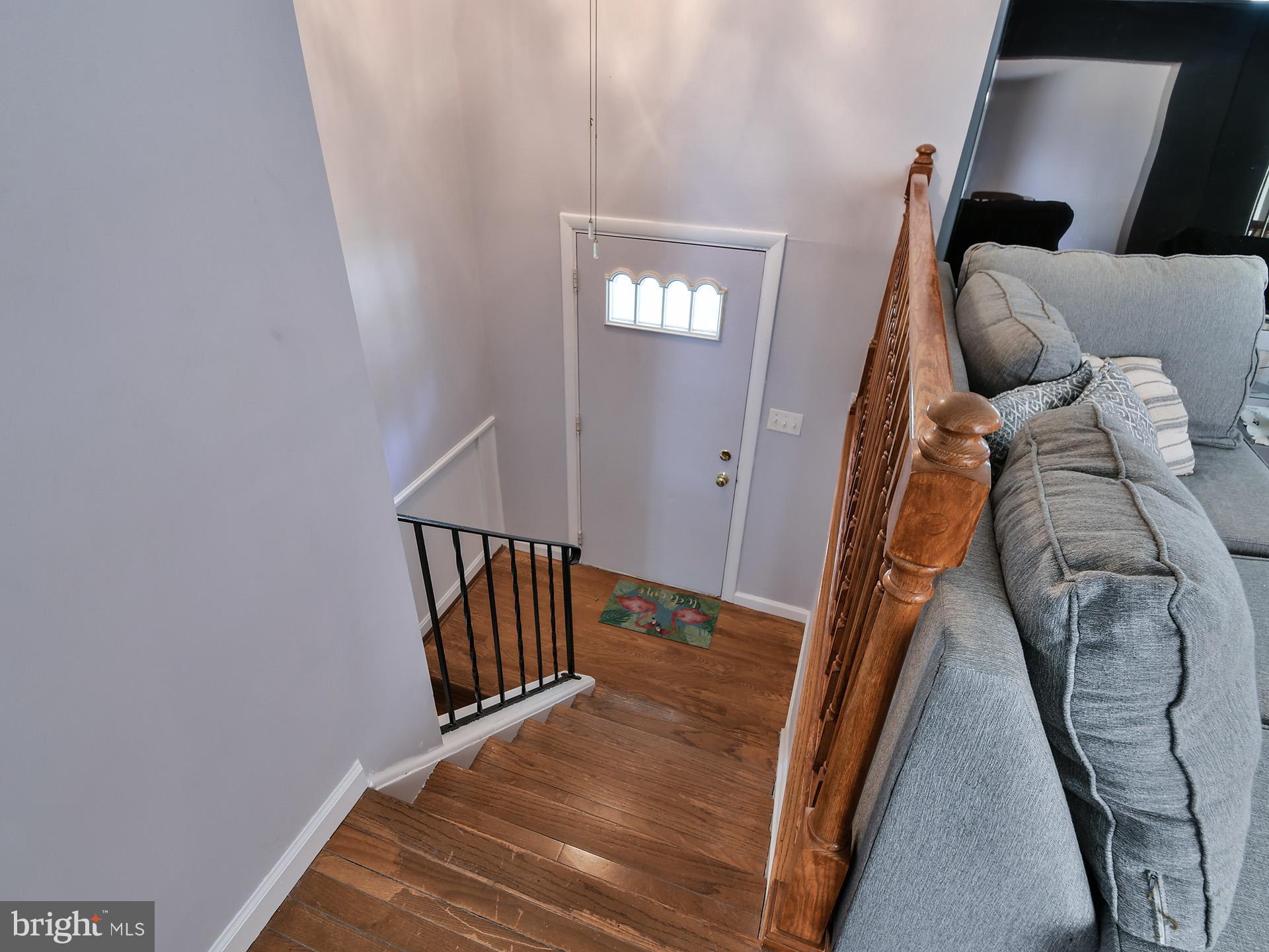 8600 Sumter Lane Clinton, MD 20735 - Photo 30 of 51 a view of a livingroom with wooden floor and stairs