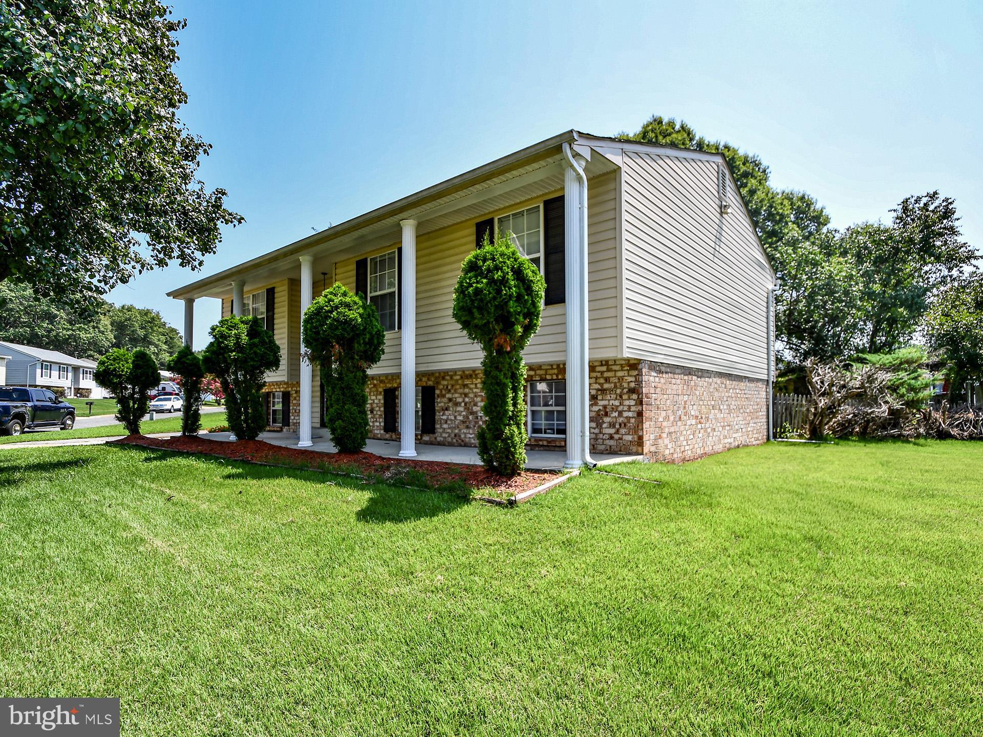 8600 Sumter Lane Clinton, MD 20735 - Photo 3 of 51 a front view of house with yard and green space