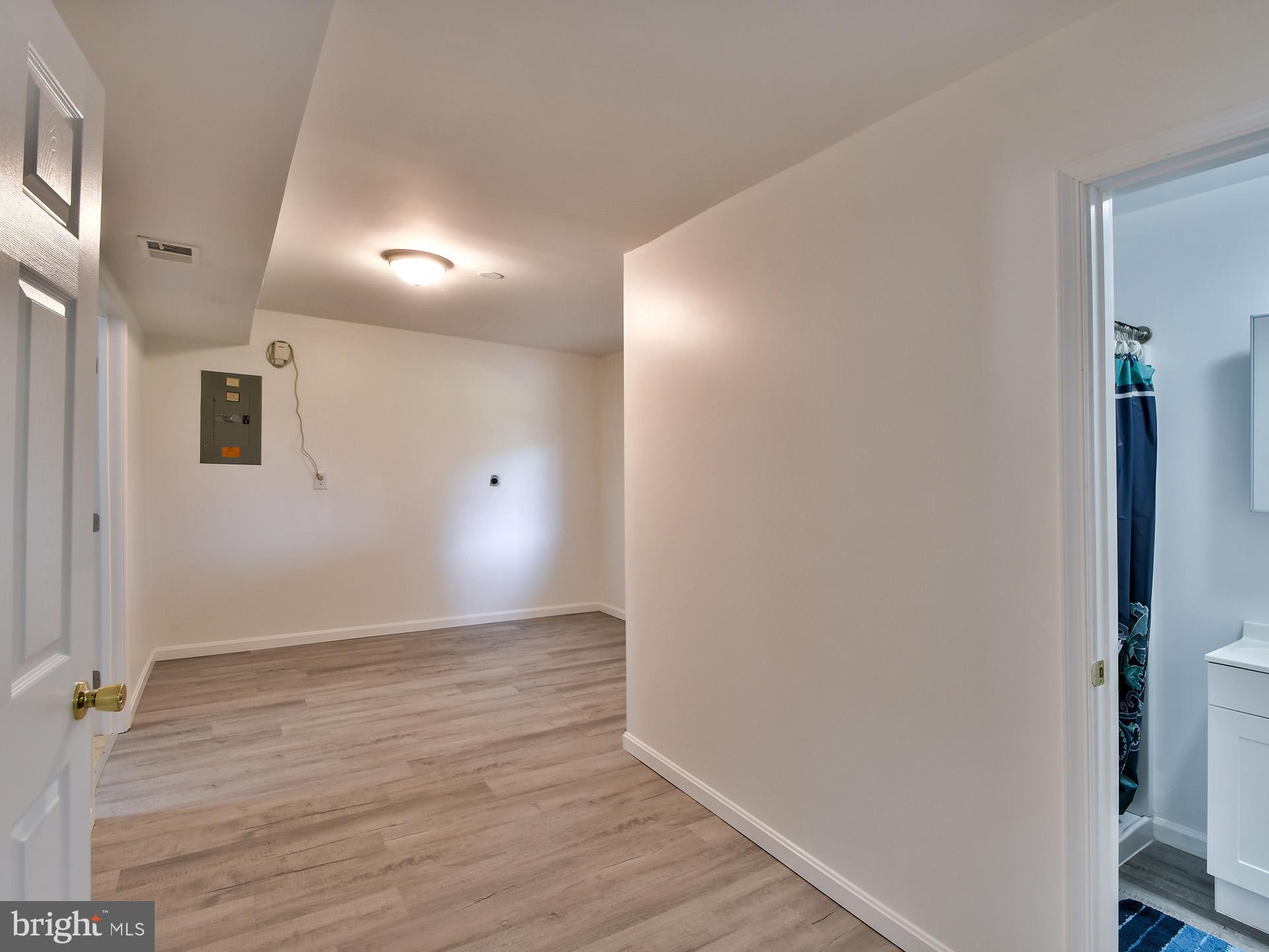 8600 Sumter Lane Clinton, MD 20735 - Photo 32 of 51 a view of an empty room with wooden floor