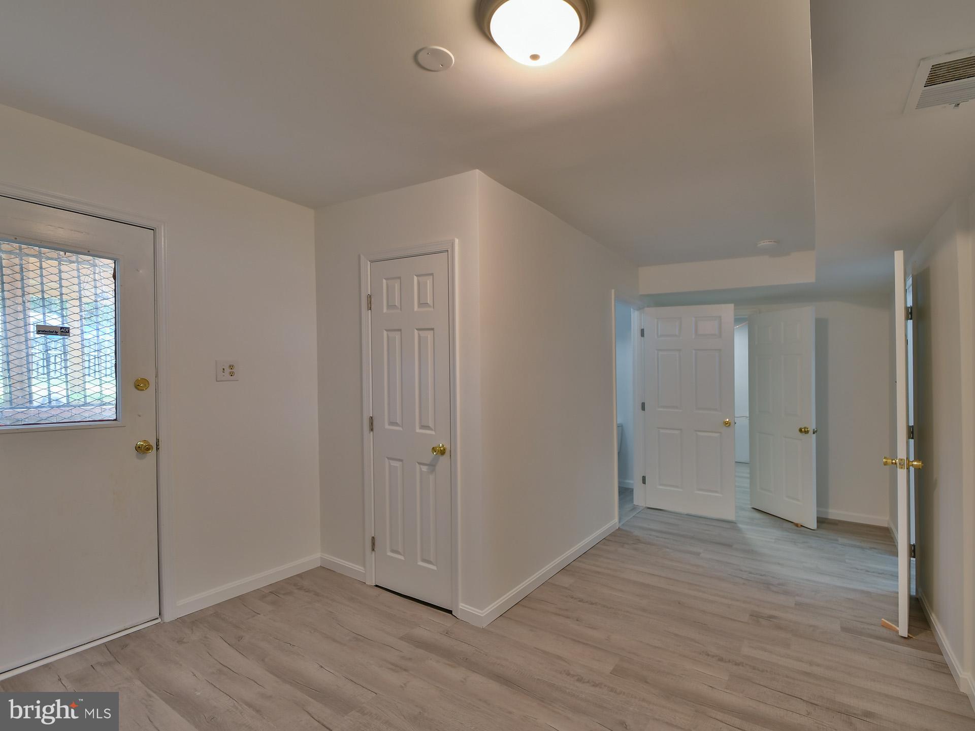 8600 Sumter Lane Clinton, MD 20735 - Photo 33 of 51 an empty room with wooden floor