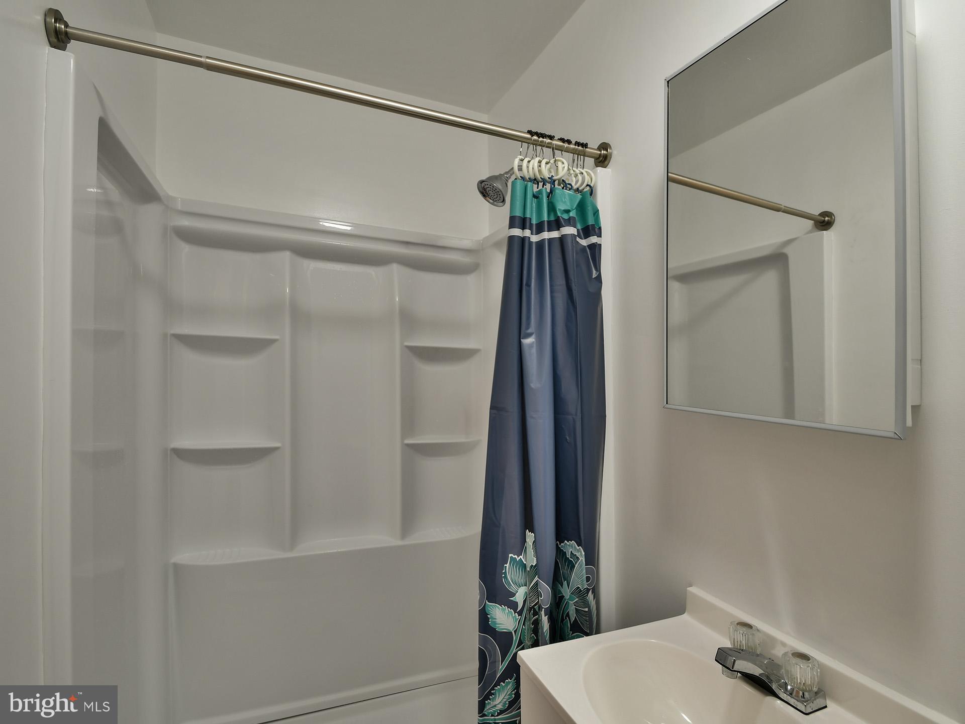 8600 Sumter Lane Clinton, MD 20735 - Photo 38 of 51 a bathroom with a shower and a sink