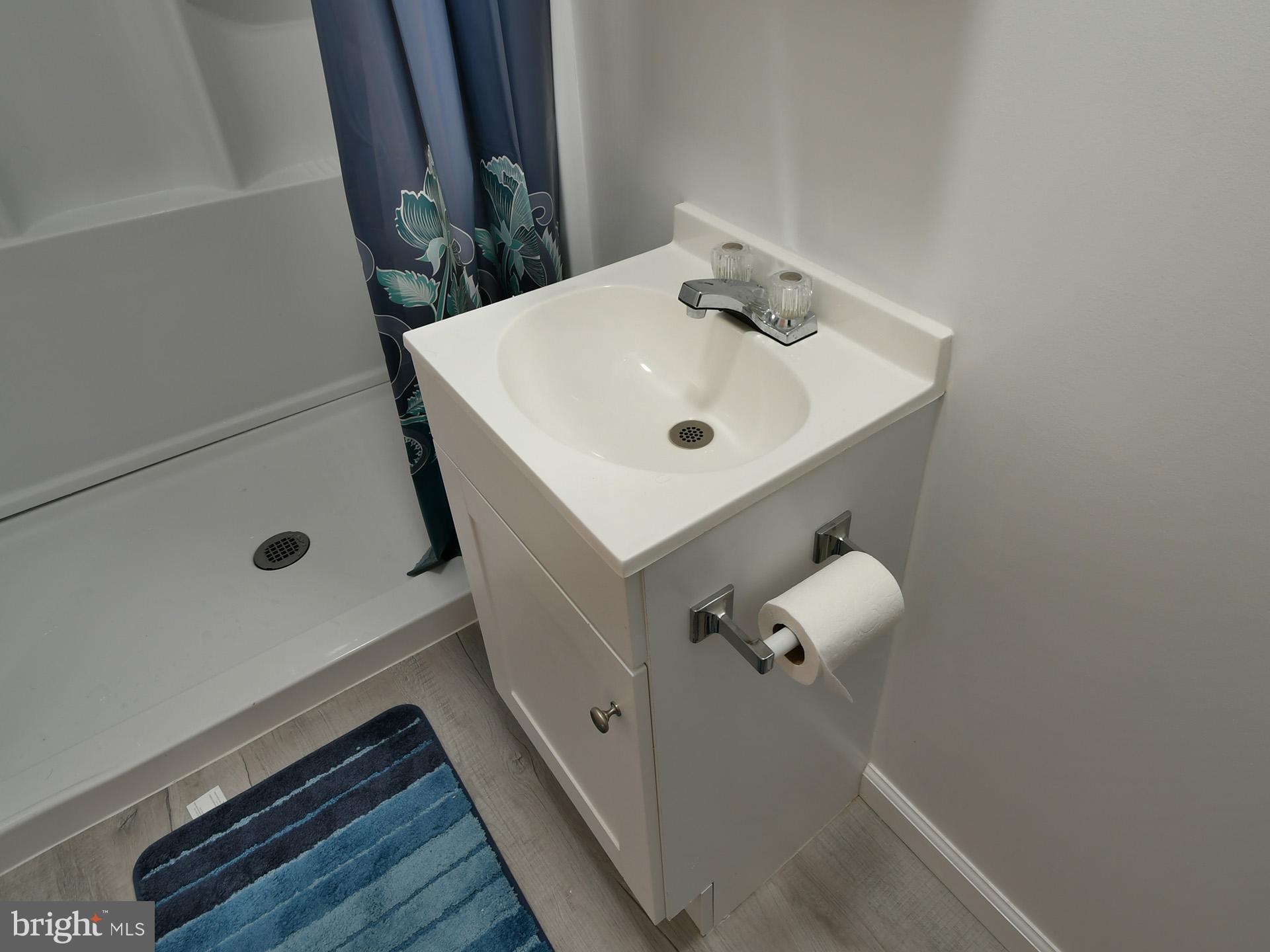 8600 Sumter Lane Clinton, MD 20735 - Photo 39 of 51 a bathroom with a sink and mirror