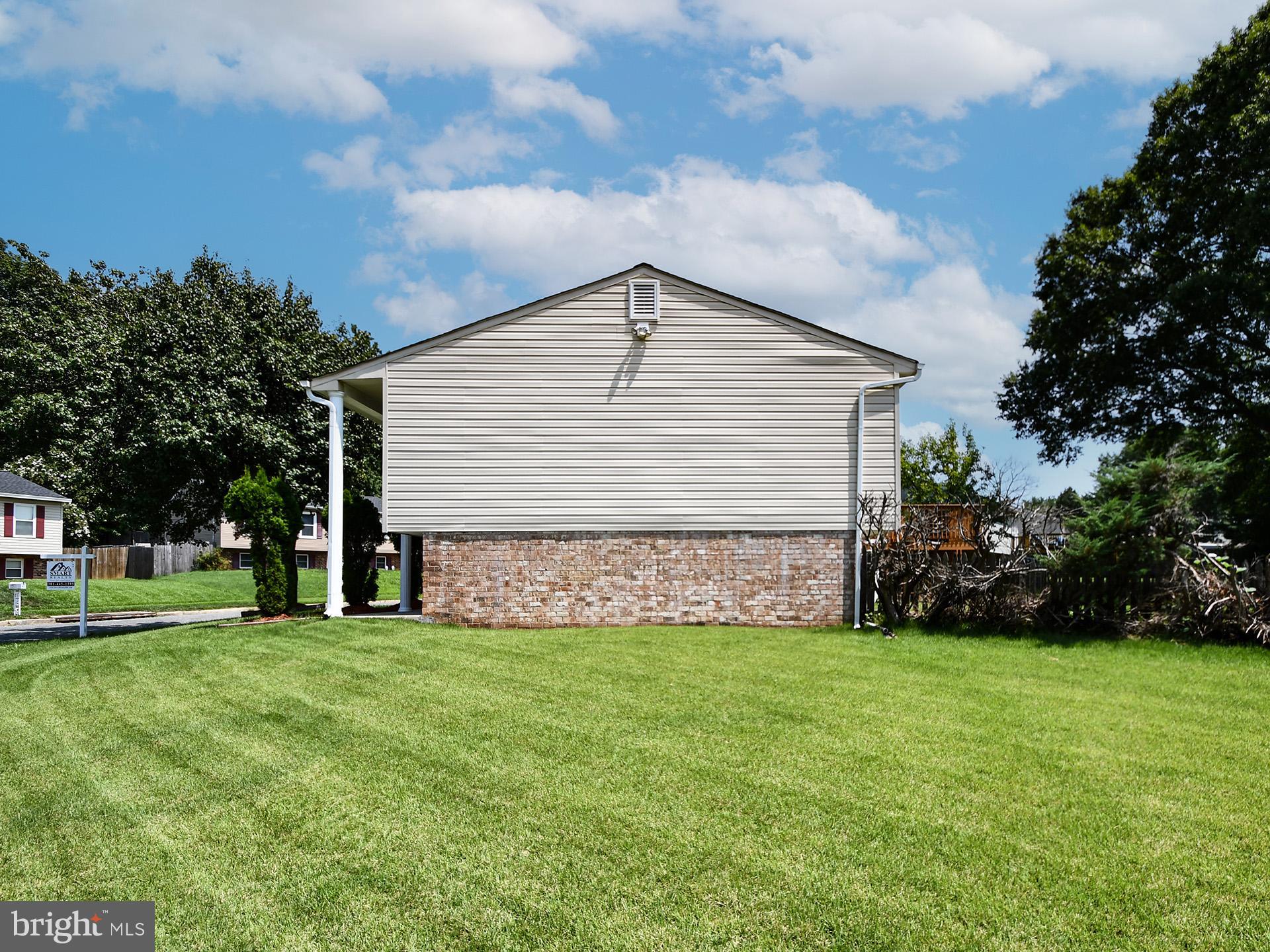 8600 Sumter Lane Clinton, MD 20735 - Photo 4 of 51 a front view of house with yard