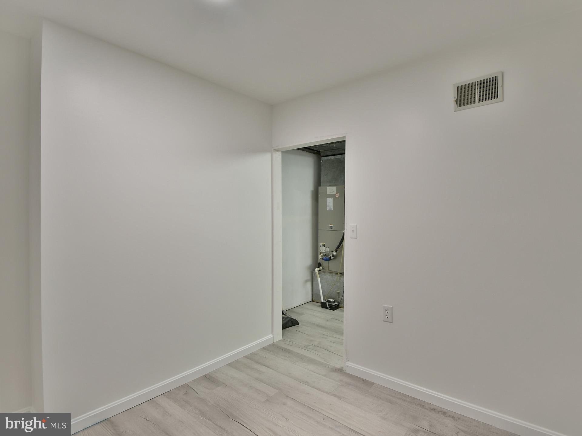 8600 Sumter Lane Clinton, MD 20735 - Photo 44 of 51 a view of an empty room with wooden floor