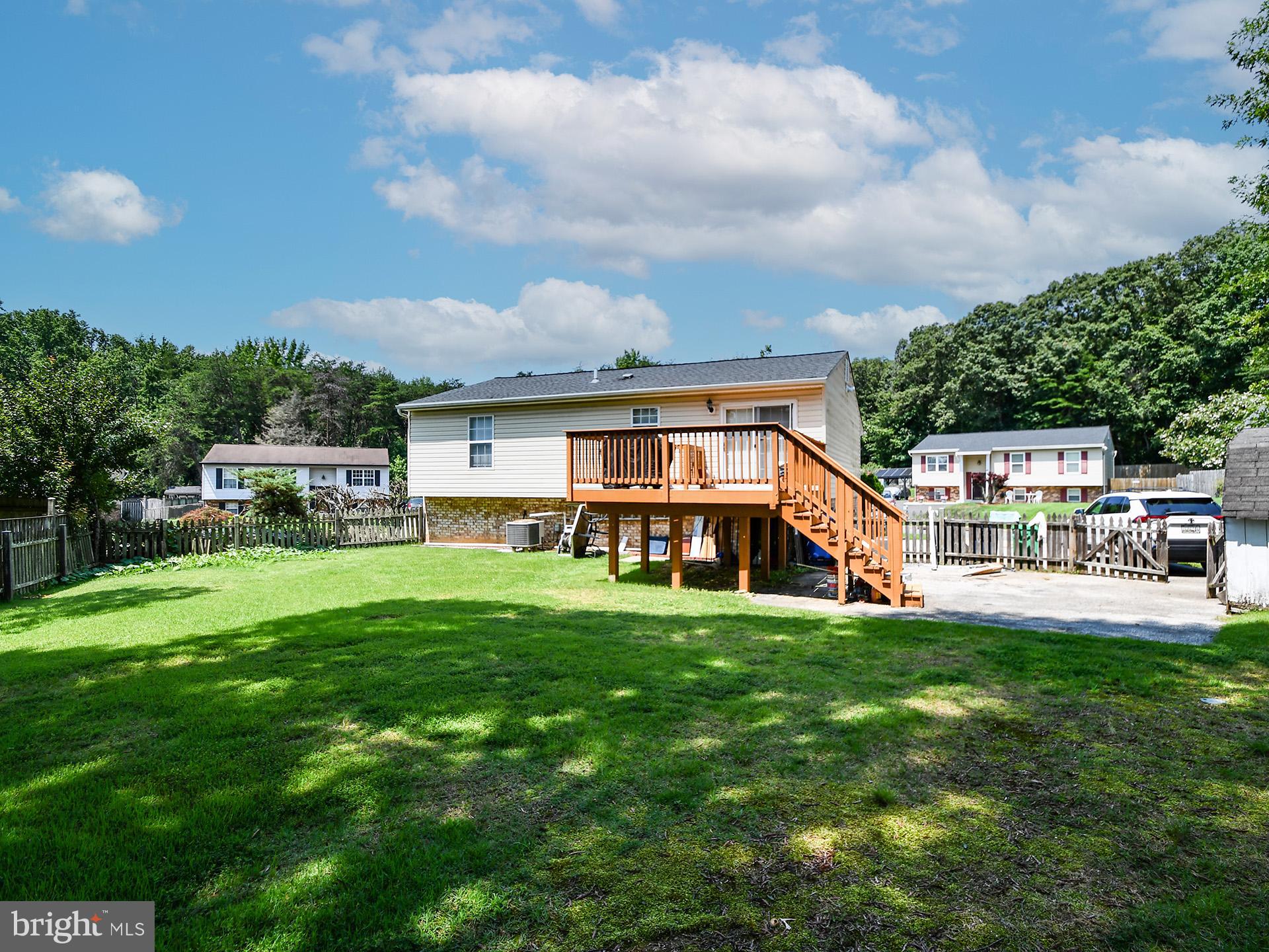 8600 Sumter Lane Clinton, MD 20735 - Photo 6 of 51 a view of a house with a big yard and large trees