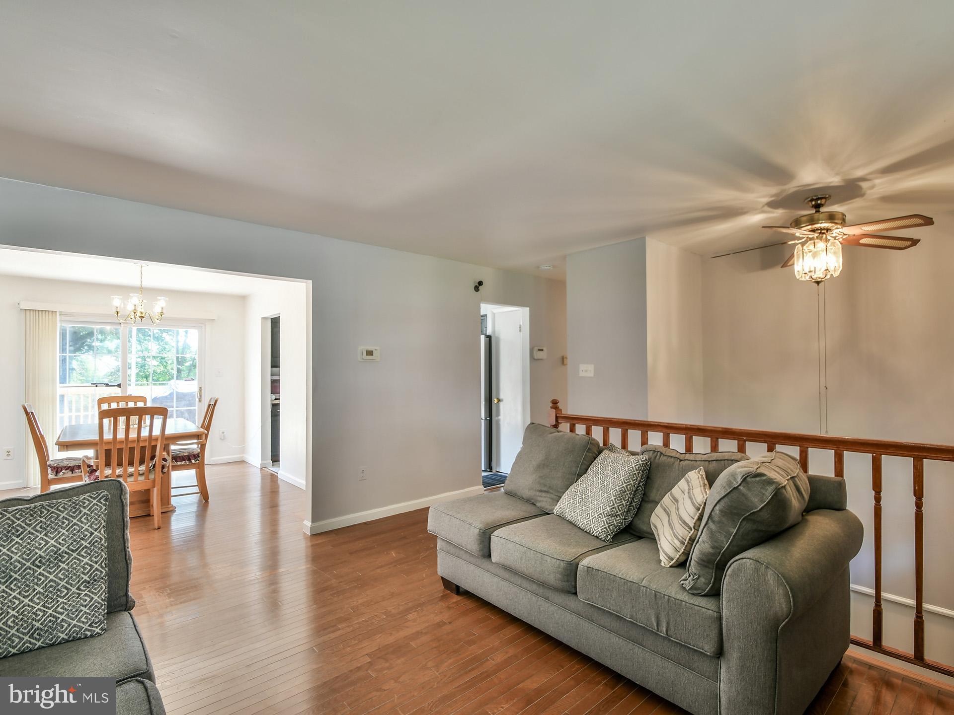 8600 Sumter Lane Clinton, MD 20735 - Photo 9 of 51 a living room with furniture and a table