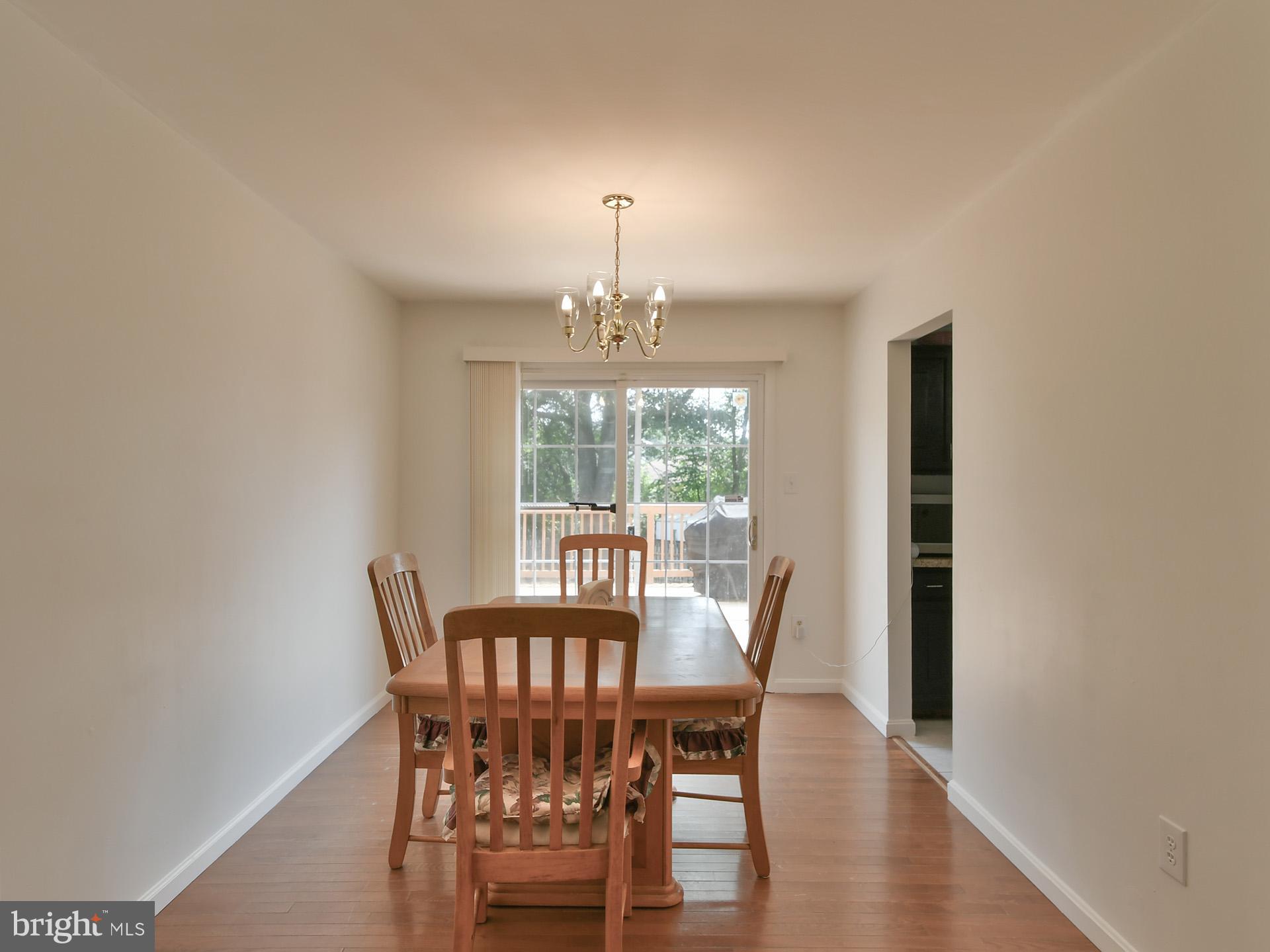 8600 Sumter Lane Clinton, MD 20735 - Photo 10 of 51 a view of a dining room with furniture window and wooden floor