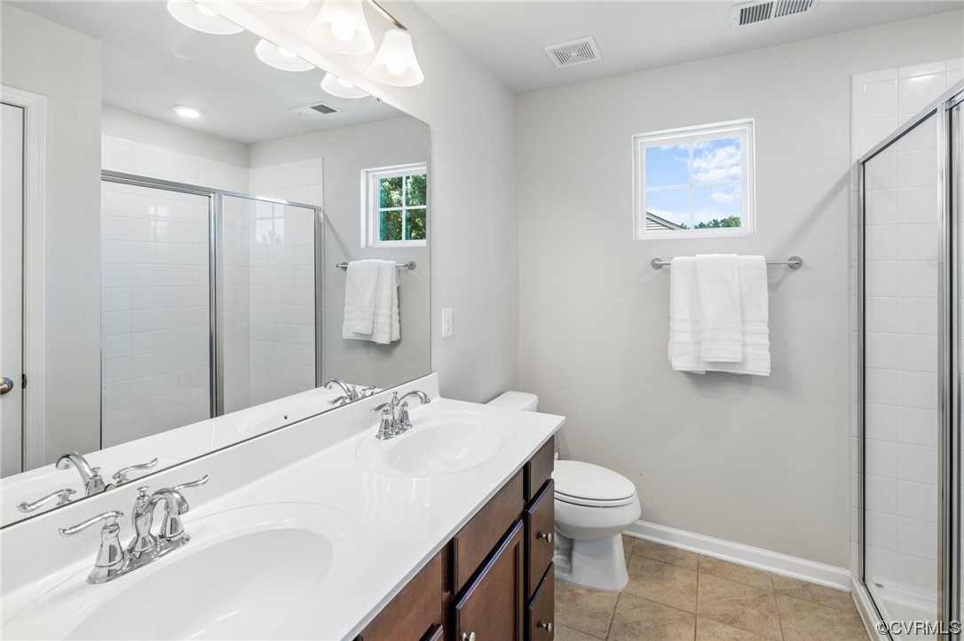 5419 Sandy Ridge Terrace Chesterfield, VA 23832 - Photo 18 of 27 a bathroom with a granite countertop sink a toilet and a mirror