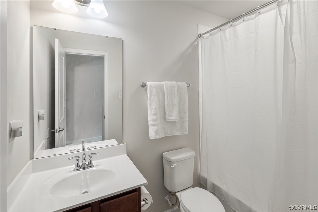 5419 Sandy Ridge Terrace Chesterfield, VA 23832 - Photo 22 of 27 a bathroom with a toilet a sink and a mirror