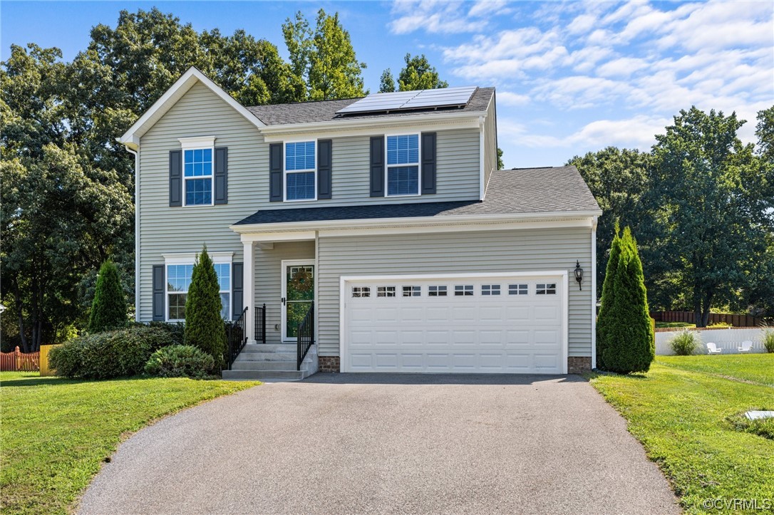 5419 Sandy Ridge Terrace Chesterfield, VA 23832 - Photo 27 of 27 a front view of a house with a yard and garage