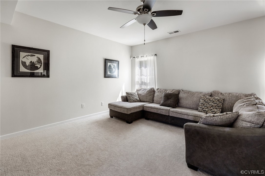 5419 Sandy Ridge Terrace Chesterfield, VA 23832 - Photo 4 of 27 a living room with furniture and a ceiling fan