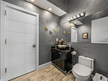 a bathroom with a sink double vanity granite and a mirror