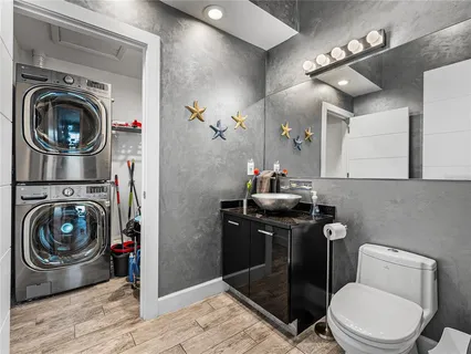 a bathroom with a tub a toilet and a shower