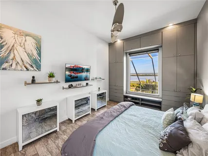 a view of a lake with sunset in background