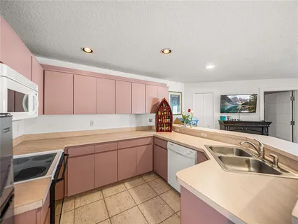 an aerial view of a house with outdoor space and street view