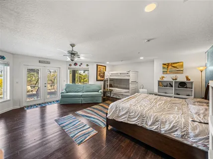 an aerial view of a house with a garden and yard