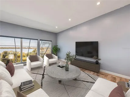 a kitchen with stainless steel appliances granite countertop a refrigerator a sink and a stove