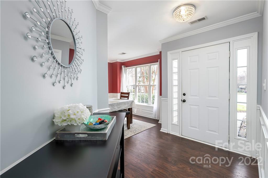 7601 Silverton Way Huntersville, NC 28078 - Photo 3 of 26 a dining room with furniture and wooden floor