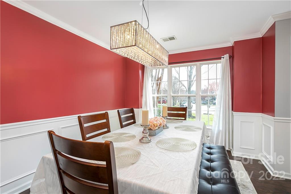 7601 Silverton Way Huntersville, NC 28078 - Photo 4 of 26 a living room with furniture and a floor to ceiling window